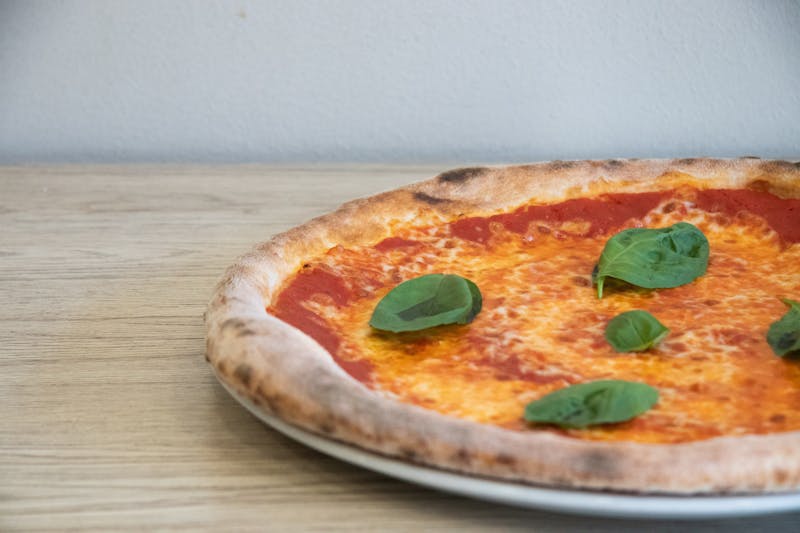 Margherita coal-fired pizza with fresh basil and mozzarella